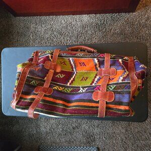 Kimi leather carpet bag, immense space and in good condition, Clasp is broken.